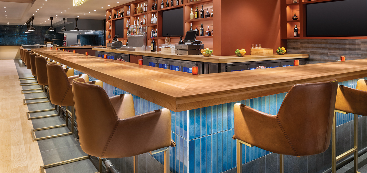 The remodeled bar and stools inside the Radisson Hotel & Conference Center Green Bay as by Tri-North Builders construction.